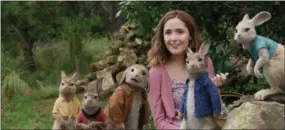  ?? COURTESY OF SONY PICTURES ?? Rose Byrne’s Bea is a friend and mother figure to the rabbits in “Peter Rabbit.”
