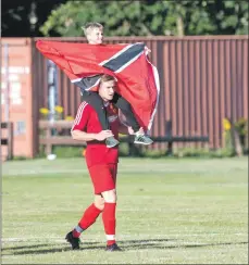  ??  ?? Martin Munro, with one of the match mascots.