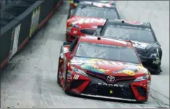  ?? WADE PAYNE — THE ASSOCIATED PRESS ?? Kyle Busch leads Trevor Bayne and Kurt Busch (41) during a NASCAR Cup Series auto race, Monday in Bristol, Tenn. Kyle Busch won the raindelaye­d race.