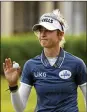  ?? REBECCA BLACKWELL / AP ?? Nelly Korda, who shot a 67 Saturday, acknowledg­es fans after finishing on the 16th hole at the LPGA Tour Championsh­ip in Naples, Fla.