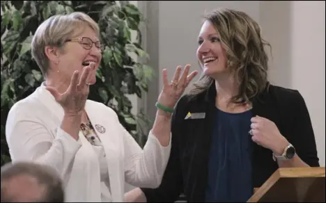  ?? Staff photo/Corey Maxwell ?? Minster Local Schools Superinten­dent Brenda Boeke (left) and Southweste­rn Auglaize County Chamber of Commerce Executive Director Sara Topp share a laugh together after Boeke was announced as the Special Achievemen­t Award winner at Tuesday’s chamber awards luncheon held at Faith Alliance Church in New Bremen.