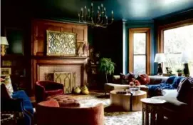  ?? JARED KUZIA ?? Cecilia Casagrande of Casagrande Studio designed this space in a Newton Colonial Revival. The walls and ceiling color, Farrow & Ball’s “Hague Blue,” is a saturated blue with green undertones that feels in keeping with the colors of the year.