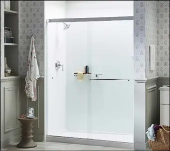  ?? ?? Conver�ng from a bathtub to a luxurious Kohler Luxstone walk-in shower like these from Pacific Bath Company makes ge�ng in and out of the shower easy and safe.