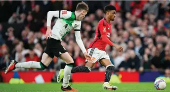  ?? — AFP photo ?? Manchester United’s midfielder Diallo (right) vies with Liverpool’s defender Conor Bradley in the build-up to scoring the winning goal during the English FA Cup Quarter Final match at Old Trafford in Manchester, north west England.