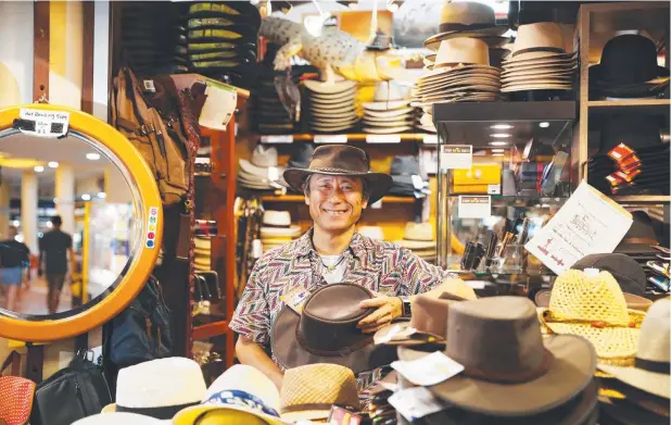  ?? Picture: BRENDAN RADKE ?? POPULAR NICHE: Yatsuki Hirakawa owns the Quality Aussie Bush Hats and Oilskins store at the Night Markets.