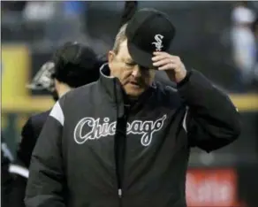  ?? NAM Y. HUH — THE ASSOCIATED PRESS ?? Chicago White Sox pitching coach Don Cooper walks to the dugout before the team’s game against the Texas Rangers on Friday in Chicago.