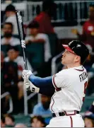  ?? ASSOCIATED PRESS ?? ATLANTA BRAVES’ FREDDIE FREEMAN (5) watches the flight of a ball hit for a solo-home run in the sixth inning against the Arizona Diamondbac­ks on Friday in Atlanta.