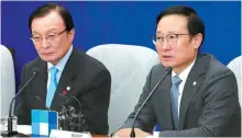  ?? Yonhap ?? Democratic Party of Korea (DPK) floor leader Hong Young-pyo, right, speaks at a party leaders meeting at the National Assembly, Wednesday, regarding the recent influence-peddling allegation­s brought against DPK Rep. Seo Young-kyo.
