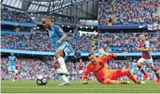  ?? – Reuters ?? BRILLIANT: Manchester City’s Raheem Sterling takes the ball away from West Ham’s Adrian during their Premier League match at Etihad Stadium on Sunday.