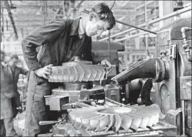  ?? Getty Images ?? A WORKER FINISHES jet engine parts at a Rolls Royce factory in 1947. Experts say soft skills such as troublesho­oting and intuition have become more important.