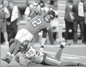  ?? AP FILE PHOTO ?? Minnesota Vikings linebacker Anthony Barr (55) tackles Atlanta Falcons quarterbac­k Matt Ryan (2) during a Dec. 3 game in Atlanta. Four of the league’s top defenses go at it Sunday when the Eagles host the Vikings and the Patriots face the Jaguars.