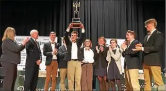  ?? SUBMITTED PHOTO ?? 2017 Delco Hi-Q Champions Haverford High team proudly holds up the Donna Zerby trophy while FMFCU Executive Vice President and CFO Michael B. Magnavita, second from left) and Dr. Maria Edelberg, executive director of DCIU, left, look on.