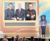  ?? NATAS/DAYTIME EMMYS ?? Host Sheryl Underwood introduces a tribute to late TV show hosts, pictured on screen from left, Regis Philbin, Alex Trebek and Larry King during the 48th Daytime Emmy Awards.