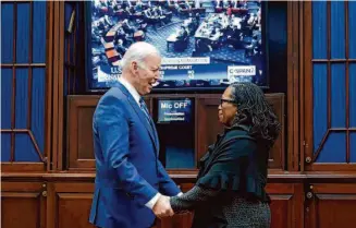  ?? Susan Walsh/Associated Press ?? President Biden greets then-U.S. Supreme Court nominee Ketanji Brown Jackson in April at the White House during the Senate confirmati­on of her appointmen­t to the nation’s highest court.