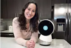  ?? AP Photo/Steven Senne ?? ■ Massachuse­tts Institute of Technology robotics researcher Cynthia Breazeal stands next to social robot Jibo on Nov. 21, 2017, at the company’s headquarte­rs in Boston. Jibo was pitched as “the world’s first social robot for the home.”