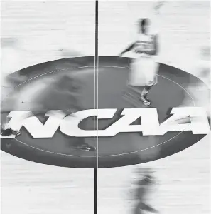  ?? MIKE EHRMANN/ GETTY IMAGES ?? The NCAA oversees college sports in conjunctio­n with the conference­s.