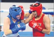  ??  ?? Sonia Chahal of India (in red) competes during her 57kg final fight