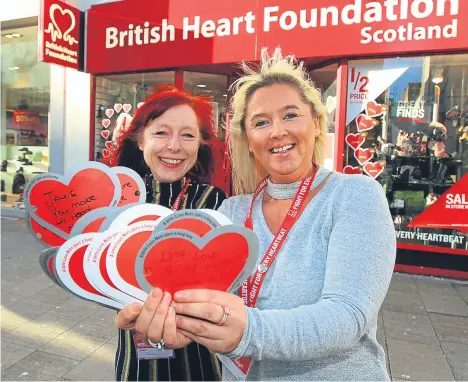  ??  ?? BRITISH Heart Foundation staff in Dundee are calling on residents to take part in a world record attempt and help fund life-saving research.
Heart-shaped messages have been filling BHF shop windows in the runup to Valentine’s Day for more than a...