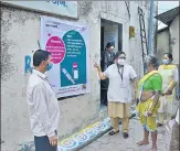  ?? PRAFUL GANGURDE / HT PHOTO ?? Health workers raise awareness about Covid vaccinatio­n in a village in Thane on Friday.