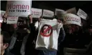  ?? Photograph: Jeenah Moon/Reuters ?? A T-shirt depicting the House speaker, Nancy Pelosi, in a No symbol among ‘Women for Trump’ signs, at a campaign rally in Wildwood, New Jersey, on 28 January 2020.