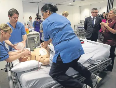  ?? Picture: PA. ?? Derek Mackay, second right, watches a teaching session on CPR in a simulated ward environmen­t at the Teaching and Learning Centre, Queen Elizabeth University Hospital, Glasgow.