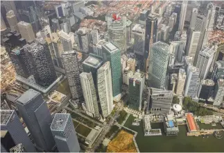  ??  ?? A VIEW OF buildings in Singapore’s central business district.