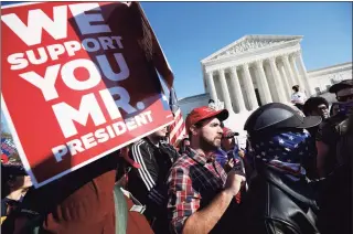  ?? Yuri Gripas / TNS ?? Members of the far-right group Proud Boys rally outside the Supreme Court building in Washington on Saturday.