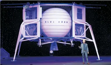  ?? Photo / AP ?? Jeff Bezos was dwarfed by his mock-up of the Blue Moon vehicle at his presentati­on.