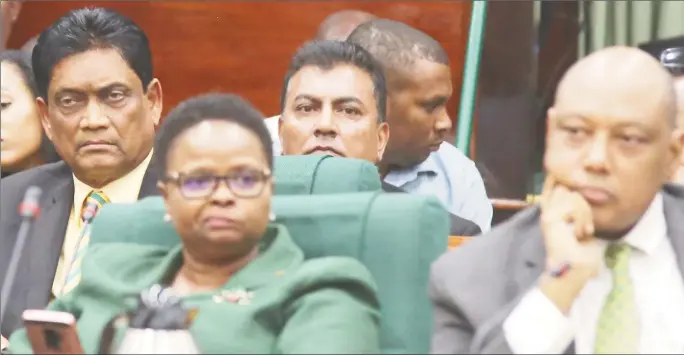  ?? Photo) (Terrence Thompson ?? Charrandas Persaud (left in back row) just after he had made his shock vote in favour of the PPP/C’s motion of no confidence. In front row from right are AFC Leader and Minister of Natural Resources Raphael Trotman and PNCR Chairman and Minister of Public Health Volda Lawrence.