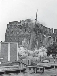  ??  ?? The Hotel King Cotton crumbles after demolition charges are set off on April 29, 1984. The Lincoln American Tower is at left and One Commerce Square is at far right. Morgan Keegan Tower stands on the site today. DAVID SMART/THE COMMERCIAL APPEAL