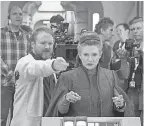  ?? DAVID JAMES/LUCASFILM ?? Johnson works with Carrie Fisher on the set of “The Last Jedi,” out Dec. 15.