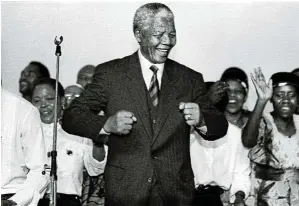  ?? ?? Mandela does the Madiba shuffle at a party in Johannesbu­rg to celebrate an ANC victory in 1994.