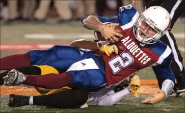  ?? The Canadian Press ?? Montreal Alouettes quarterbac­k Johnny Manziel is asked by Hamilton Tiger-Cats defensive back Will Hill during second quarter CFL football action in Montreal on Friday.