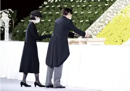  ?? ?? Crown Prince Akishino and Crown Princess Kiko offer flowers during the state funeral for former Prime Minister Shinzo Abe at the Nippon Budokan hall in Tokyo, on Tuesday.