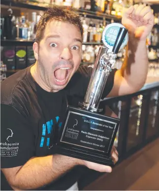  ?? Picture: RICHARD GOSLING ?? Paolo Gabriellon­i celebrates at Edgewater Restaurant with his trophy.