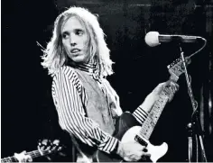  ??  ?? Petty in concert, 1977: he taught himself to compose lyrics by copying them from songs played on the radio