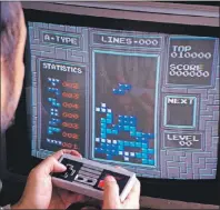  ?? AP PHOTO ?? In this June 1990 file photo, Tetris, an addictive brain-teasing video game, is shown as played on the Nintendo Entertainm­ent System in New York. This weekend audiences will pack the Philharmon­ie de Paris’ concert hall to soak in the sounds of...