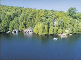  ?? Platinum Luxury Auctions ?? Aerial view of Panther Point on Upper Saranac Lake, which is scheduled to be sold at auction on Friday. L. Emmett Holt, a pioneer in pediatric medicine, had the so-called Great Camp built in the late 1800s.