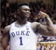  ?? CHRIS SEWARD — THE ASSOCIATED PRESS ?? Duke’s Zion Williamson (1) celebrates after he scored against North Carolina State during the second half of an NCAA college basketball game in Durham, N.C., Saturday.