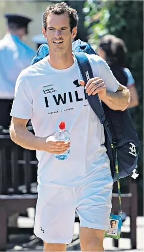  ??  ?? Sir Andy Murray walked out to practise at Wimbledon yesterday wearing a T-shirt that seemed to suggest he will overcome injury to take part. The two-time champion, who has barely played for the past year, is due to face France’s Benoit Paire in the...