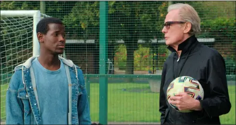  ?? NETFLIX ?? Micheal Ward, left, and Bill Nighy share a scene from “The Beautiful Game.”