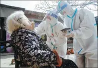  ?? HU GAOLEI / FOR CHINA DAILY ?? A senior undergoes a nucleic acid test at home in Handan, Hebei province.