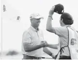  ?? SAM GREENWOOD/GETTY ?? Stewart Cink celebrates with his caddie and son, Reagan, after winning the Heritage on Sunday. It was the 47-yearold’s second win of the season.