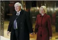  ?? THE ASSOCIATED PRESS ?? Former House Speaker Newt Gingrich and his wife, Callista Gingrich, walk to talk with media at Trump Tower on Monday in New York after meeting with President-elect Donald Trump.