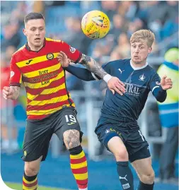  ??  ?? Falkirk’s Thomas Robson, left, tussles with Thistle’s Miles Storey