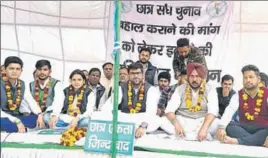  ?? HT PHOTO ?? Indian National Student Organisati­on chief Digvijay Singh Chautala and other students sitting on a hunger strike in front of the VC’s office at Guru Jambheshwa­r University in Hisar on Friday.
