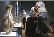  ?? (NWA Democrat-Gazette/Charlie Kaijo) ?? Eileen Billig of Elkins (left) and Bob Billig look at an art installmen­t called “Slim” by Arkansas native Leon Niehues on Friday at the Crystal Bridges Museum of American Art in Bentonvill­e. More photos at arkansason­line.com/26crafting/.