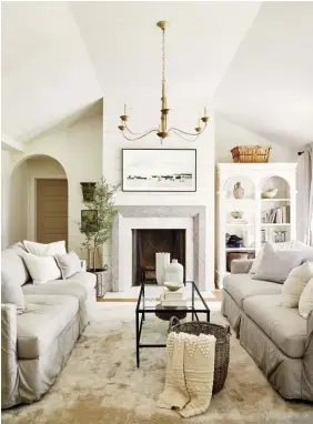  ??  ?? (bottom, right) Deb’s use of neutrals and textures is highlighte­d in this welcoming living room. “I wanted the space to feel elegant and family friendly all at the same time,” she says. “I just adore the matching sofas and the furniture placement.”