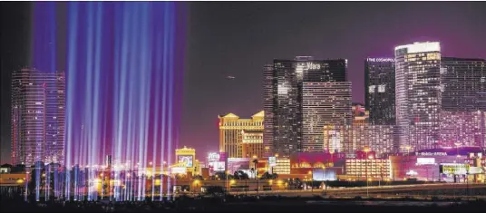  ?? Joel Angel Juarez Las Vegas Review-Journal @jajuarezph­oto ?? Fifty-eight lights honor the Oct. 1 shooting victims at the constructi­on site of the Raiders stadium after the groundbrea­king ceremony.