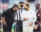  ?? Gary Cosby Jr. / Associated Press ?? Mississipp­i State coach Mike Leach, left, and Alabama coach Nick Saban talk before the start of an NCAA football game in Tuscaloosa, Ala., on Oct. 31. Alabama reached the No. 1 spot in The Associated Press Top 25 Poll for a record 13th season in a row.